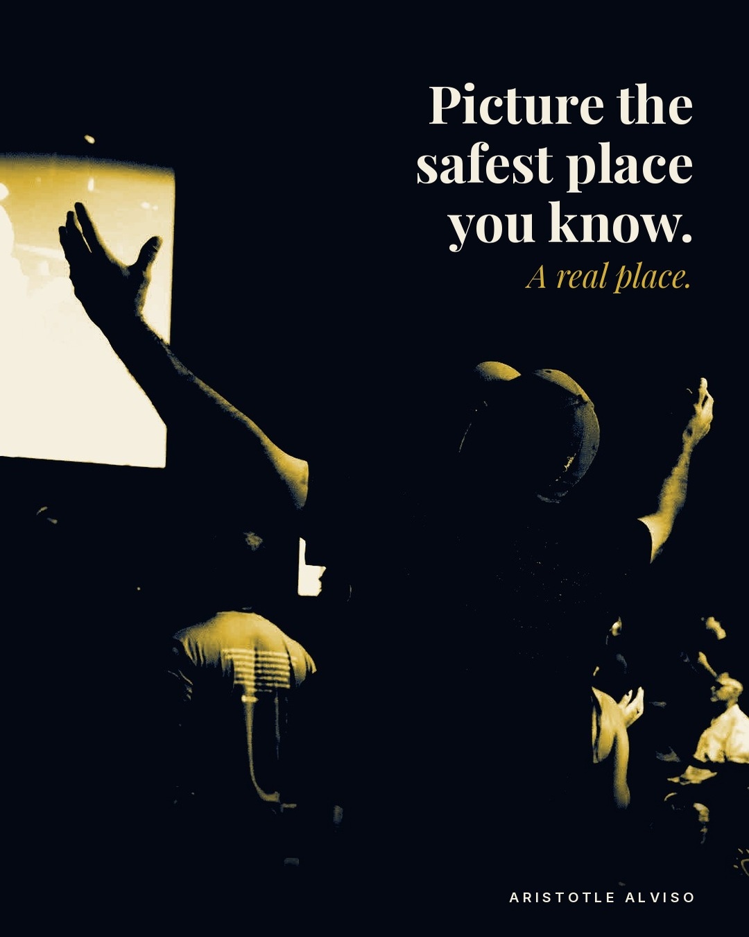 A worshipper seen from behind in a dark sanctuary, arms raised toward a glowing screen. Text: Picture the safest place you know. A real place.