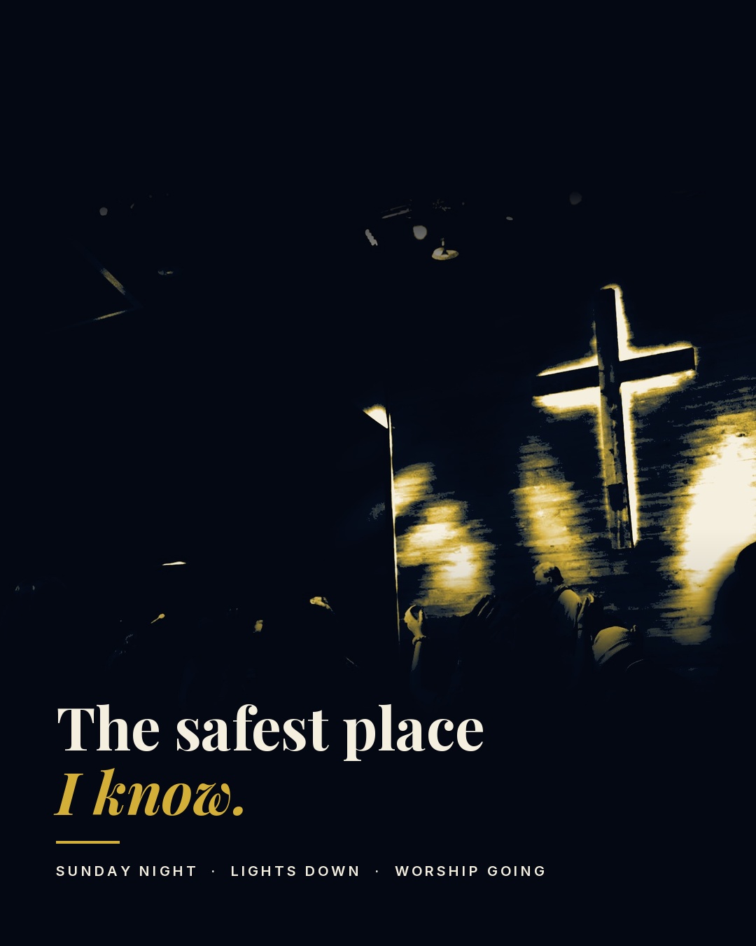 A wooden cross lit gold on the wall of a dark sanctuary during Sunday night worship. Text: The safest place I know. Sunday night, lights down, worship going.