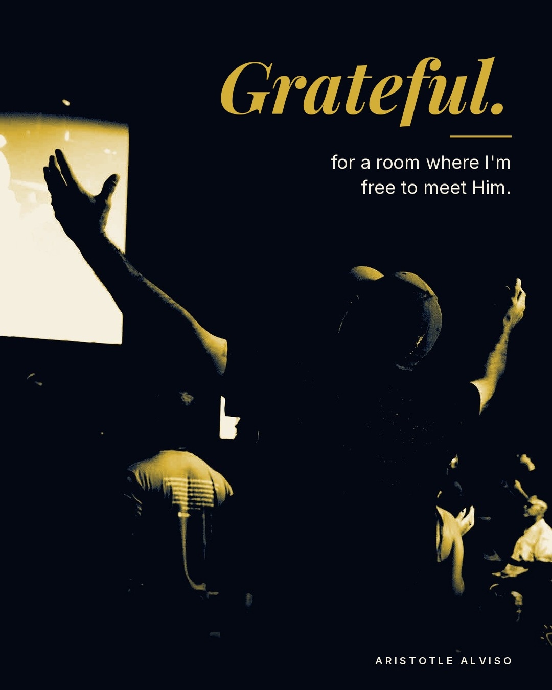 A worshipper with both arms raised in a dark room. Text: Grateful, for a room where I'm free to meet Him.
